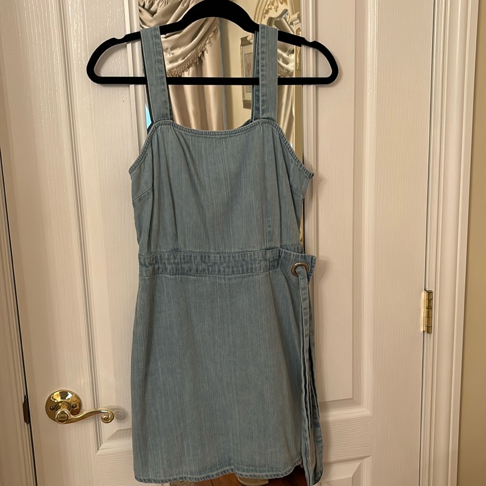 Light denim romper with faux wrap with side tie and elastic back